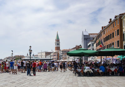 Group of people in front of buildings