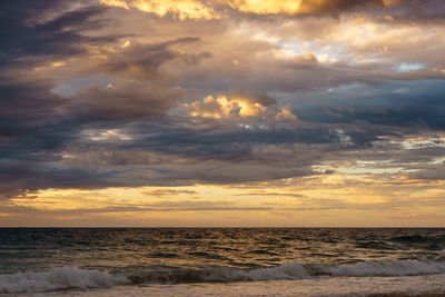 View of dramatic sky over sea during sunset