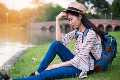 Young woman sitting in park
