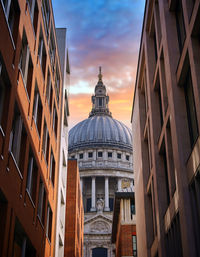 Low angle view of buildings against sky in city