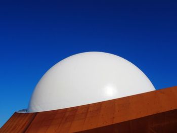 Low angle view of built structure against blue sky