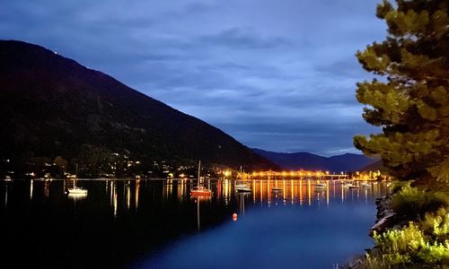 Scenic view of lake against sky at dusk