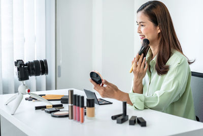 Young businesswoman working at desk in office