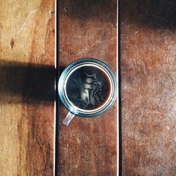 Directly above shot of coffee on wooden table
