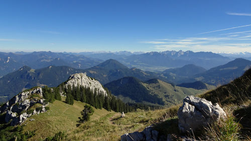 Scenic view of mountains against blue sky