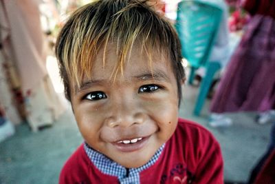 Close-up portrait of smiling boy