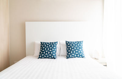 Cushions on bed at home