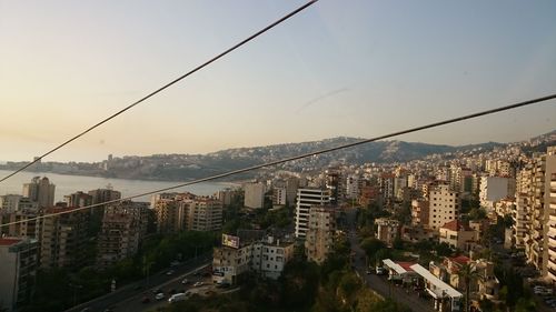 Aerial view of cityscape against clear sky