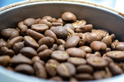 Close-up of roasted coffee beans in container