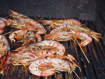 High angle view of fish on barbecue