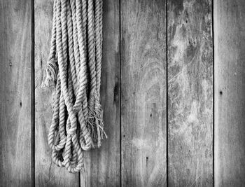 Close-up of rope tied on wooden door