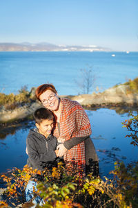 Father and son in water