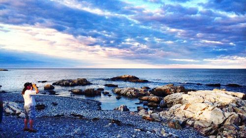 Scenic view of sea against cloudy sky