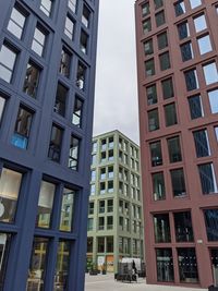 Low angle view of buildings against sky in city