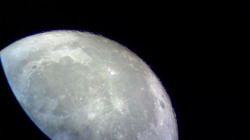 Close-up of moon against clear sky at night