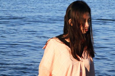 Beautiful woman looking at sea