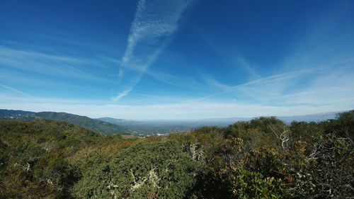 View of countryside landscape against blue sky