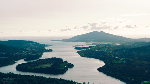 Scenic view of river, sea and mountains against sky