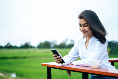 Young woman using mobile phone