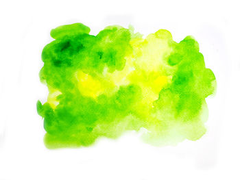 Close-up of multi colored candies against white background