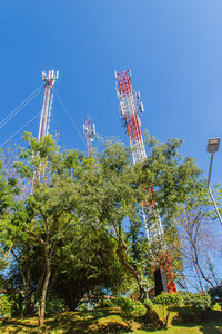 Low angle view of traditional windmill against clear blue sky