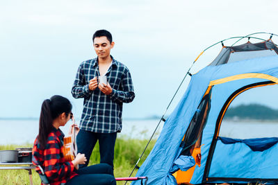 Father and son standing outdoors