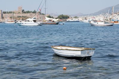 Boats moored at harbor