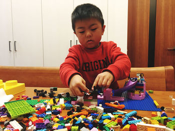 Boy playing with toy toys