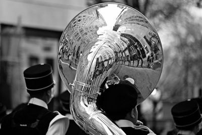 People celebrating st patrick day with reflection on tuba