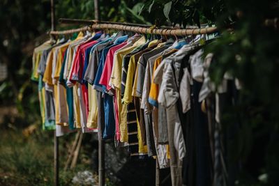 Close-up of multi colored clothes hanging on clothesline
