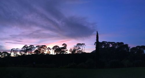 Silhouette of landscape against sky at dusk