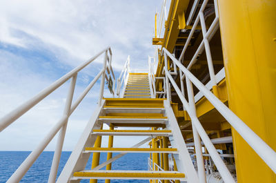 Low angle view of staircase against sky