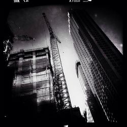 Low angle view of construction site against sky