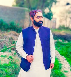 Young man standing on field
