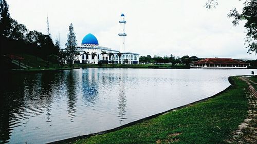 Built structure with trees in foreground