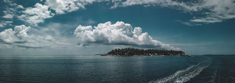 Scenic view of sea against blue sky