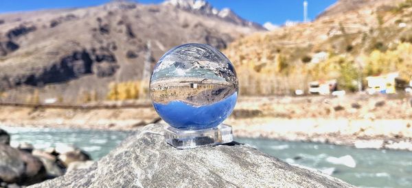 Close-up of reflection of rock in water