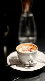 Close-up of cappuccino on table