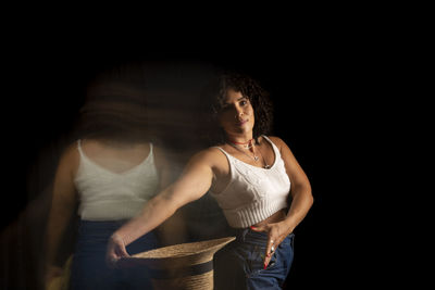 Time-lapse view of woman moving a hat. long exposure, motion blur. 