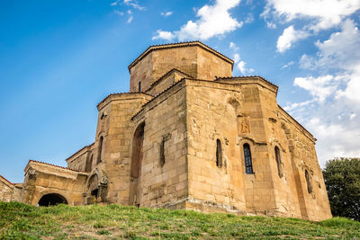 Low angle view of old building against sky