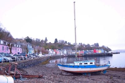 Boats moored at harbor