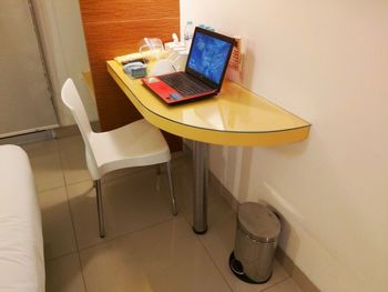 High angle view of laptop on table at home