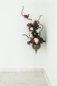 Close-up of vase against white wall