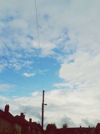 Low angle view of building against cloudy sky