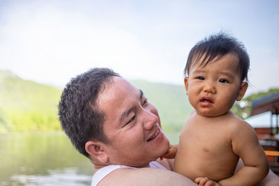 Close-up of father and daughter while standing outdoors