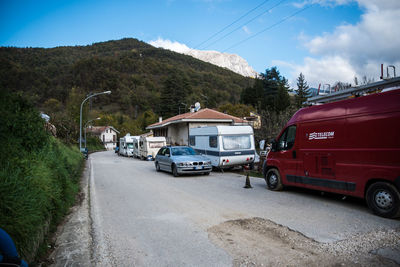 Cars on road against sky