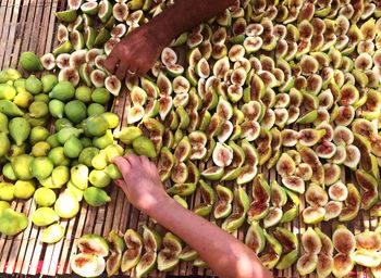 High angle view of hand holding fruits