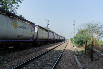 Train on railroad track against sky