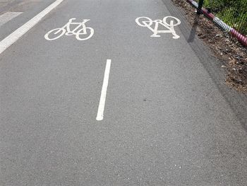 High angle view of bicycle signs on road