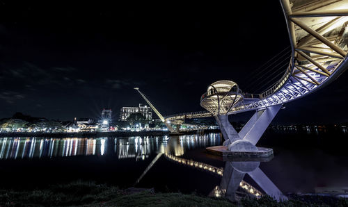 Illuminated buildings in city at night